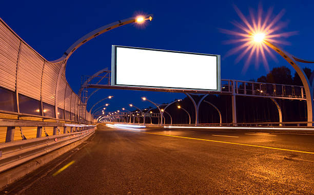 istock Big white billboard on the night highway 504572358