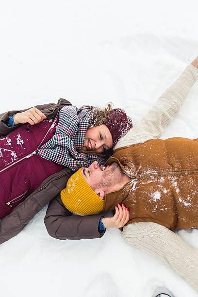 istock Young beautiful couple having fun in snow 504573698
