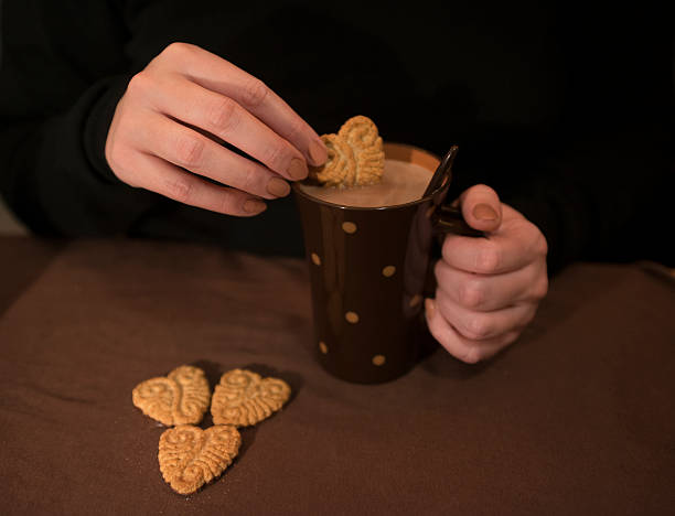 istock Dipping a Cookie in a Hot Cocoa Drink 504575592