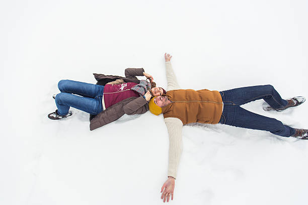 istock Carefree young couple playing with snow 504576016