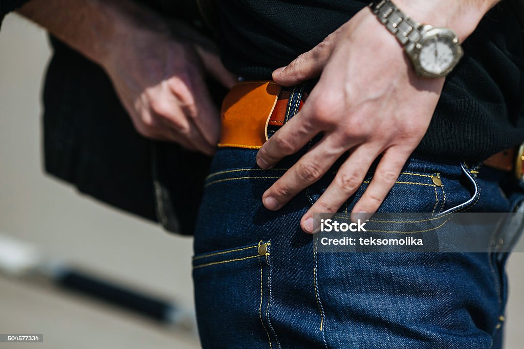 man dressed in jeans, a close-up shot Confident man posing in selvedge  jeans. A man dressed in jeans, a close-up shot Adult Stock Photo