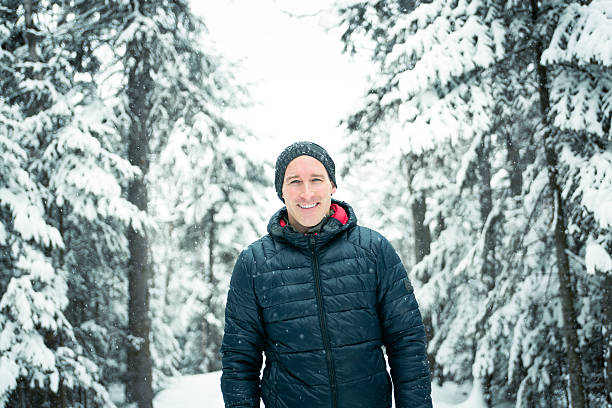 istock Happy man in winter season with tree on the back 504577652