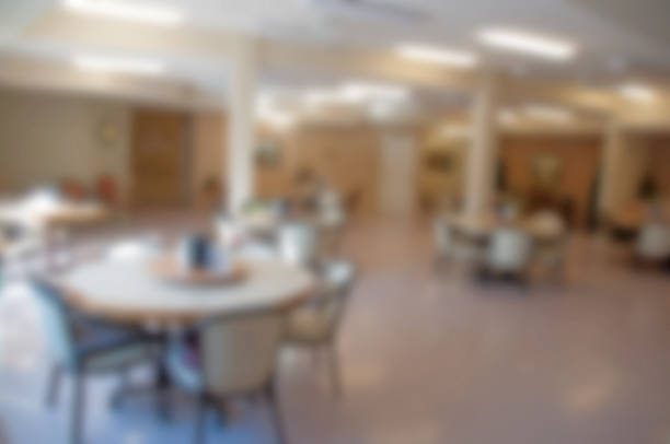 istock Empty Seniors' home dining area with wheelchair and walker room 504579170