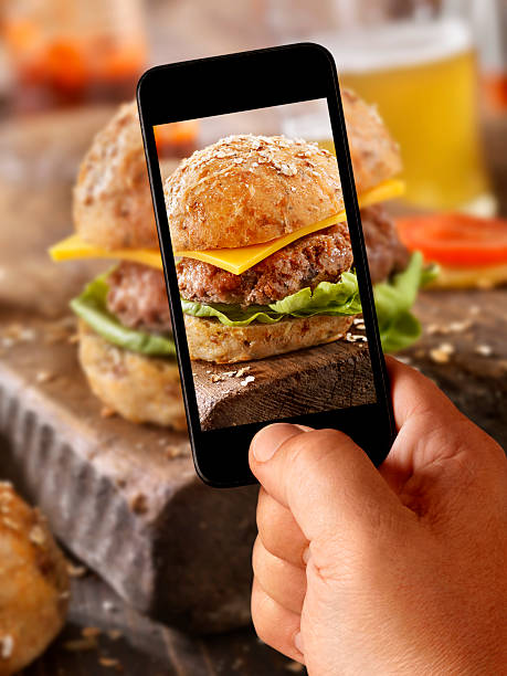 istock Mobile Photography of Cheeseburger with a Beer 504579408