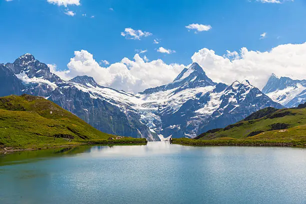 Panorama view of Bachalpsee and the snow coverd peaks including Schreckhorn, Wetterhorn with glacier of swiss alps, on Bernese Oberland, Switzerland.