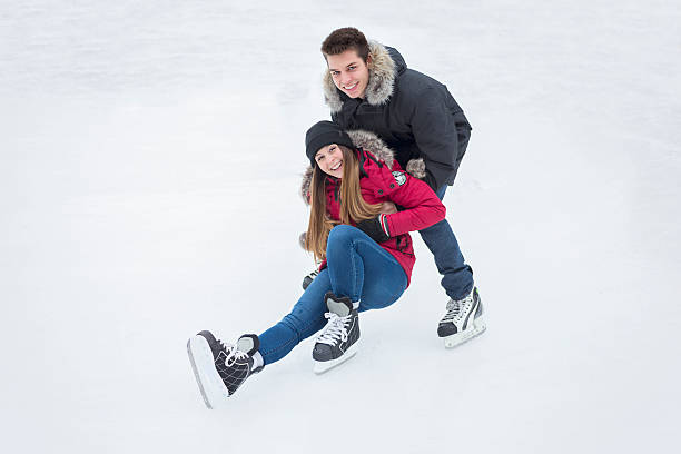 istock Ice skating couple having winter fun on ice skates Quebec 504580592