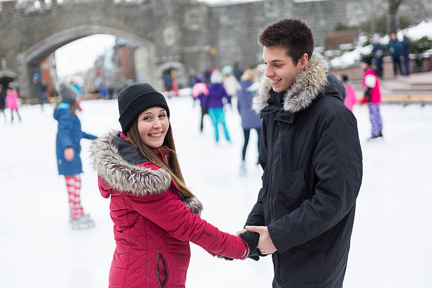 istock Ice skating couple having winter fun on ice skates Quebec 504580676