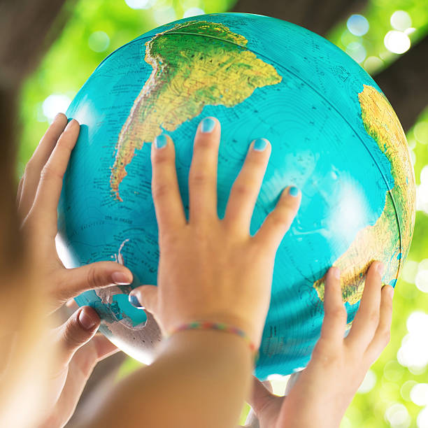 istock Group of People Holding a Globe 504580739