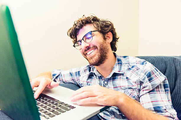 istock Online American Man Laughing at Social Media Networking 504581136