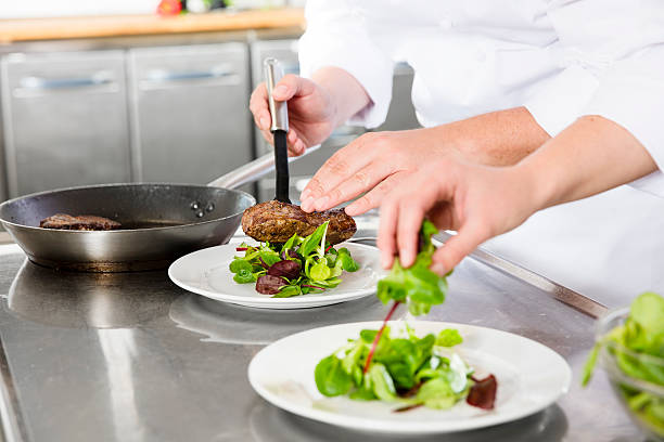 istock Professional chefs prepares steak dishes at restaurant 504581990