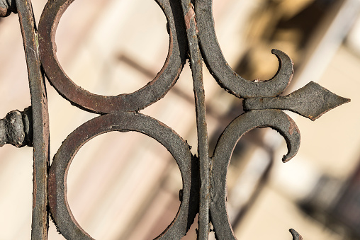 Closeup of a wrought iron railing of a balcony of a classic building in the old town of Barcelona; Catalonia, Spain