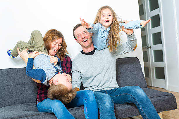 istock Nice family sit on the livingroom sofa 504583544
