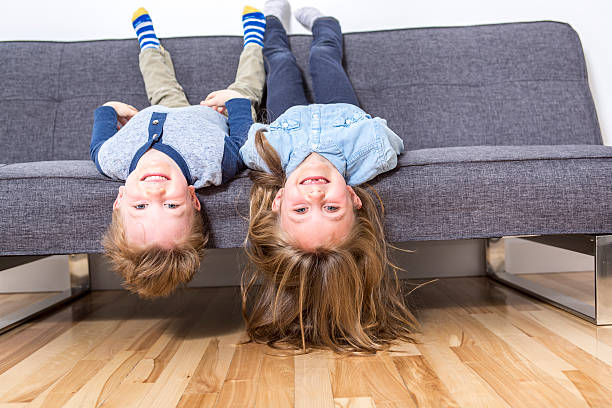 istock two nice child boy and girl on sofa 504583842