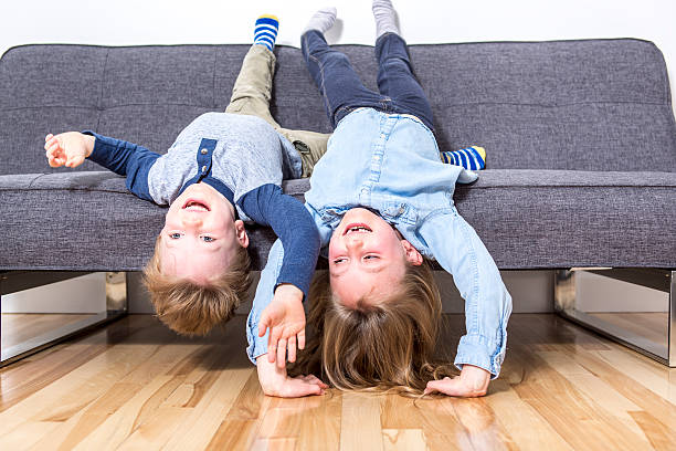 istock two nice child boy and girl on sofa 504583932