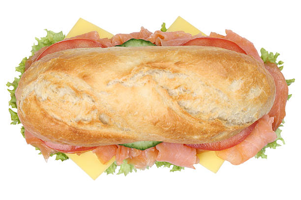 istock Sub deli sandwich baguette with salmon fish top view isolated 504583936