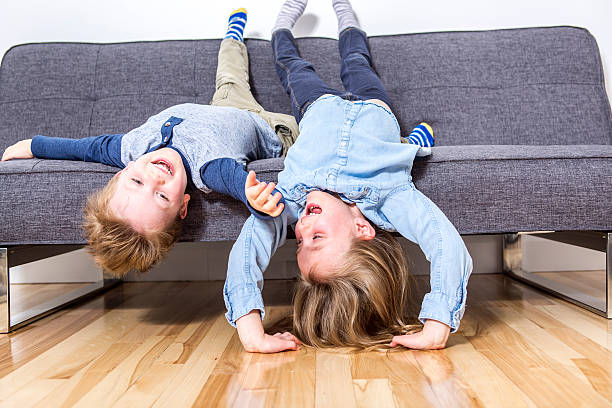 istock two nice child boy and girl on sofa 504583962