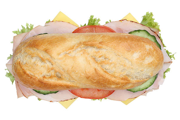 istock Sub deli sandwich baguette with ham top view isolated 504584364