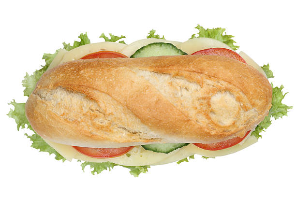 istock Sub deli sandwich baguette with cheese top view isolated 504584828