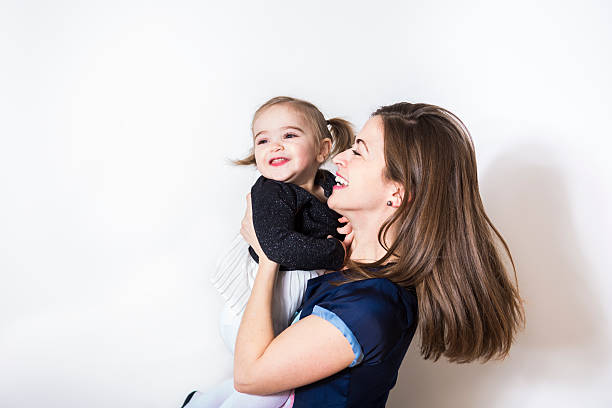 istock mummy and her kid on a white wall 504584976