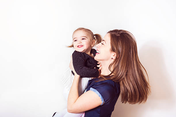 istock mummy and her kid on a white wall 504584992