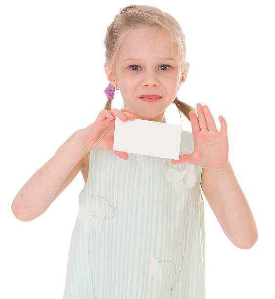 istock cheerful little girl with white blank 504585207