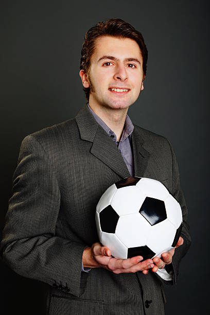 istock Young man with soccer ball 504585222