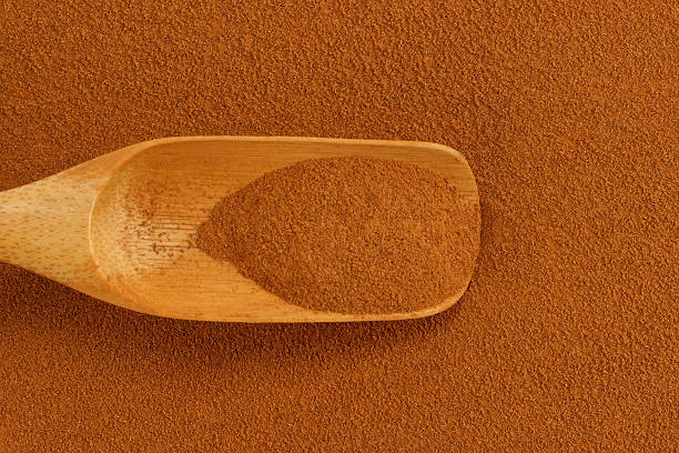 istock Cinnamon powder and bamboo scoop 504585373