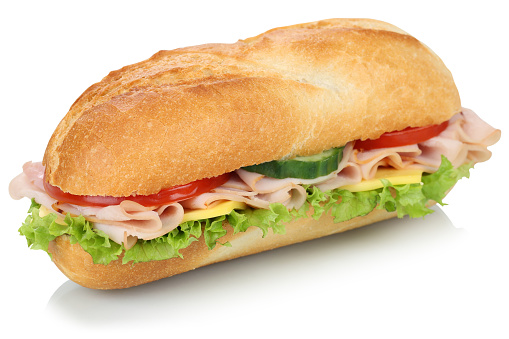 Sub deli sandwich baguette with ham, cheese, tomatoes and lettuce isolated on a white background
