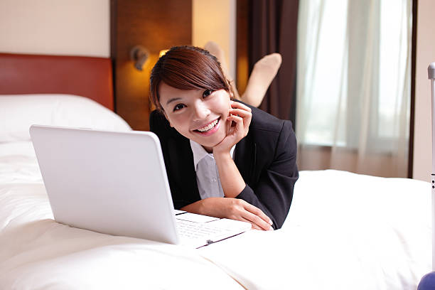 istock business woman with notebook lying in hotel 504586665