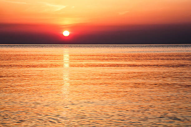 istock Sun track on water at the sunrise 504589260