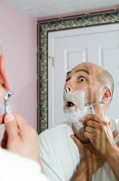 istock Shaving with mouth wide open 504601135