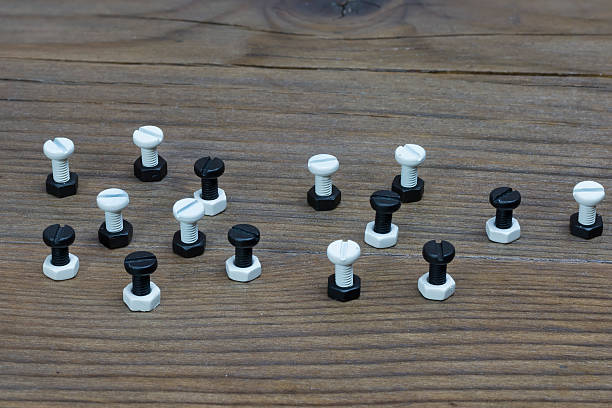 istock Black and white nuts and bolts 504601907