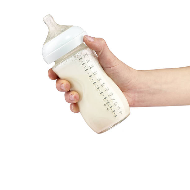 istock Mother prepares baby milk. 504603051