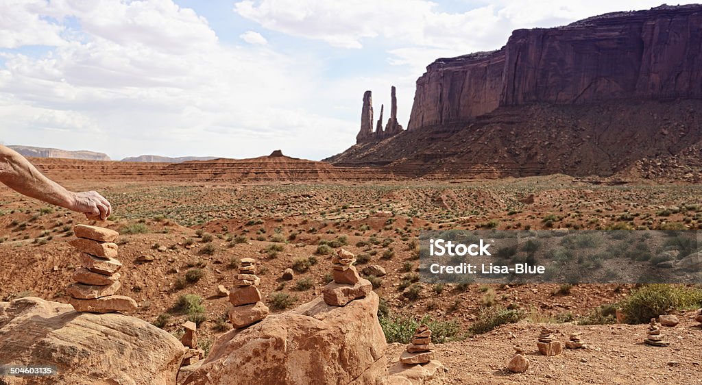 Stacking Stones, Monument Valley Stacking Stones, Monument Valley, USA Adult Stock Photo