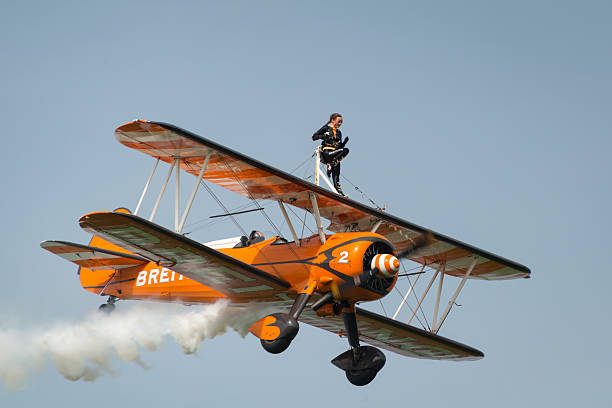 Breitling Wing Walkers Abingdon, UK - 4th May, 2014:  Breitling Wing Walker team displaying at Abingdon Airshow stunt airplane airshow air vehicle stock pictures, royalty-free photos & images