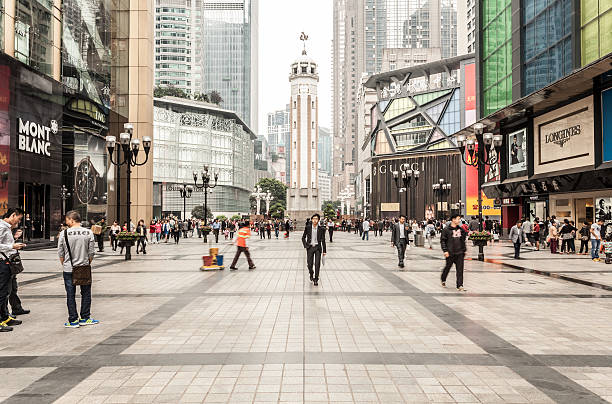 Chongqing, China - October 23, 2014: Chongqing Liberation Monument Pedestrian Street, the famous landmark. There are many shops and financial buildings around it.
