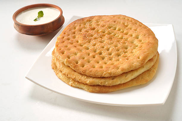 Kulcha with Yogurt A traditional Pakistani and Indian bread taftan stock pictures, royalty-free photos & images