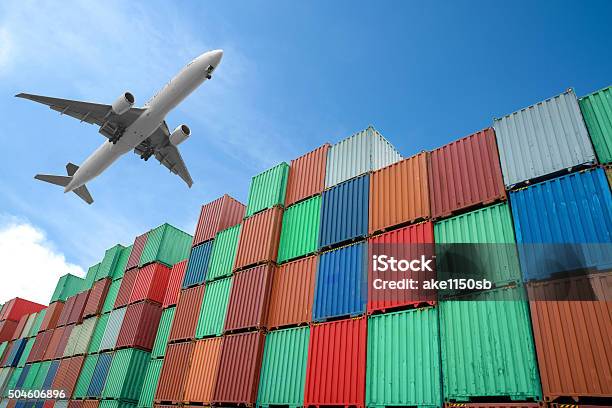 Stack Of Cargo Containers At The Docks Stock Photo - Download Image Now - Freight Transportation, Wind, Airplane