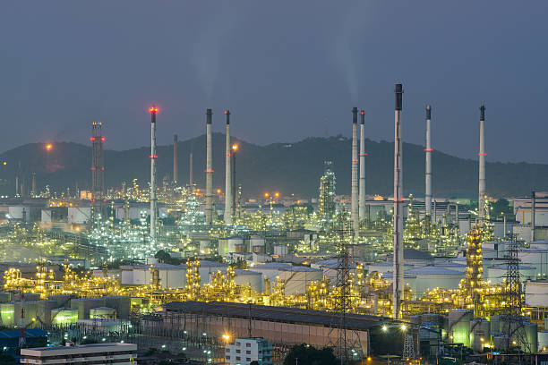 istock Oil refinery and storage tanks at twilight 504607138