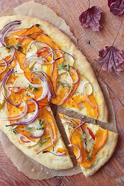 Pizza with pumpkin ,apple and red onion