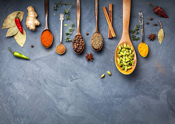 istock Various Spices near blackboard at blue stone background 504607546