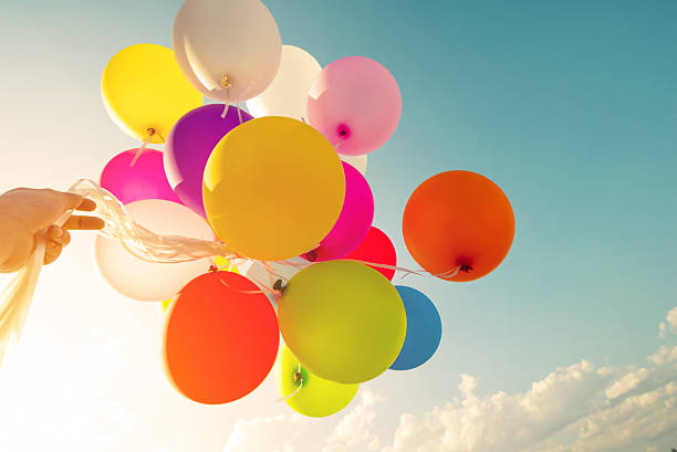 istock and holding colorful balloons 504608260
