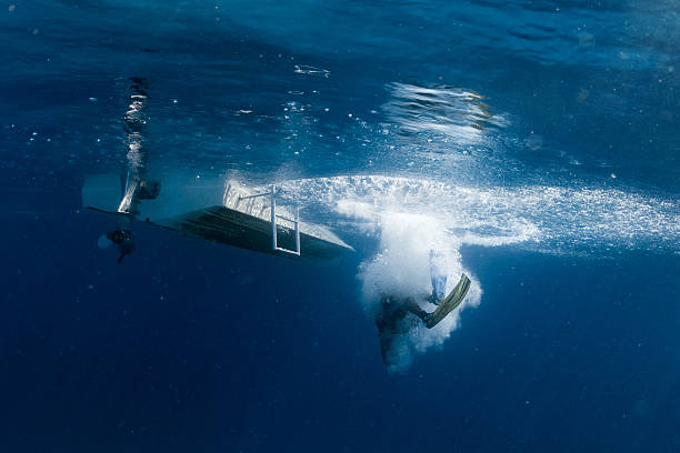 istock scuba diver jumping from boat 504610692