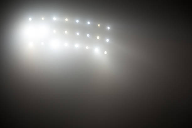 istock Bright white and yellow Stadium lights with fog. Defocused image 504611988