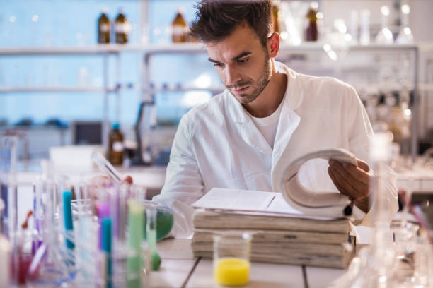 istock Young scientist reading scientific data in a laboratory. 504613184
