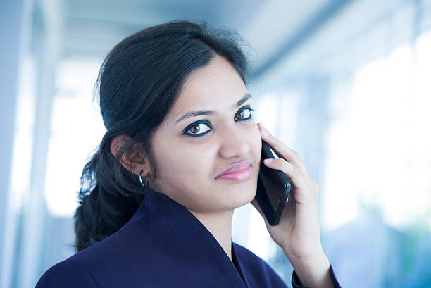 istock young indian office worker talking on the phone 504613248