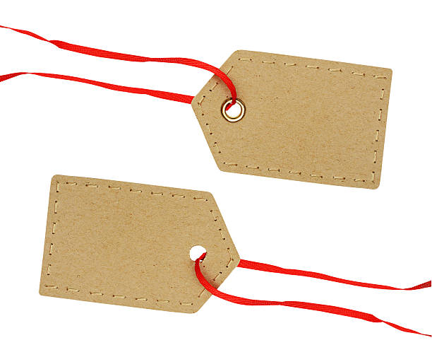 istock Cardboard labels on red ribbon 504614690