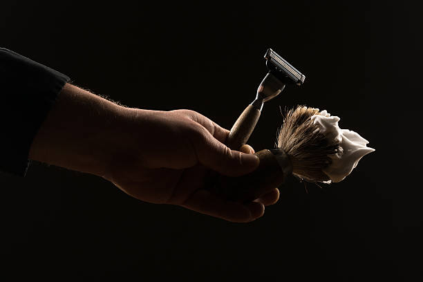 istock male hand holding shaving equipment 504616272