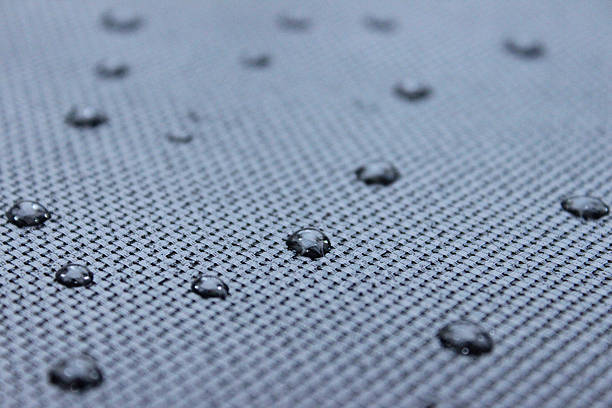istock Image of abstract background, fine water droplets on grey mesh 504616576