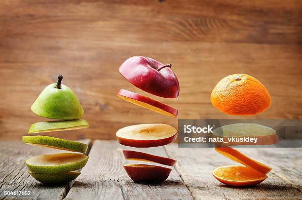 Flying Slices Of Fruit Stock Photo - Download Image Now - Apple - Fruit, Citrus Fruit, Food